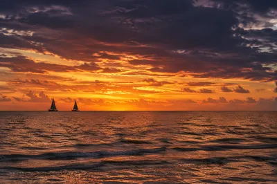 Peaceful Sailboats on Ocean Sunset Horizon