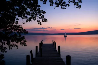 Sailboat on Calm Lake at Twilight