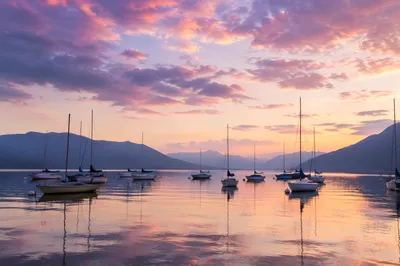 Calm Sailboats on Alpine Lake at Sunset