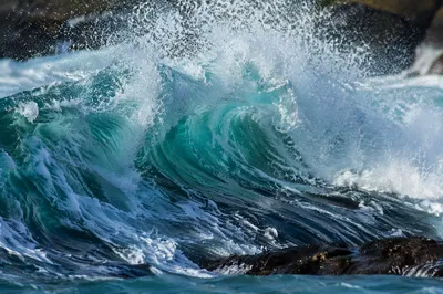Turquoise Wave Breaking Over Coastal Tide Pools