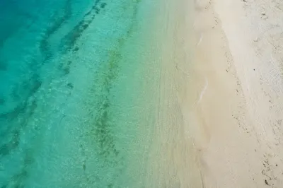 Aerial Turquoise Lagoon and White Sand Beach