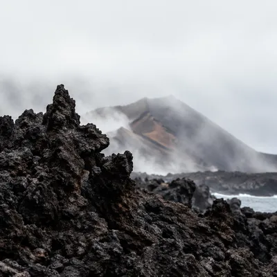 Rugged Black Lava Coast in Mist