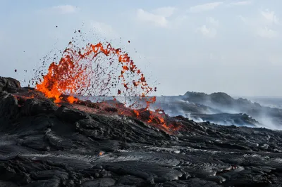 Glowing Lava Arc on Black Basalt Coast