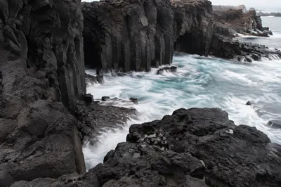 Black Volcanic Lava Coast and Ocean Cove