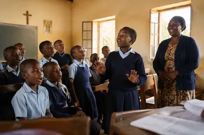 African Schoolchildren Singing in Bright Classroom