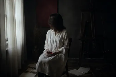Solitary Artist by Window in Shadow