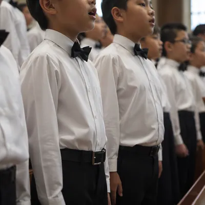 Asian Children Church Choir in White Shirts