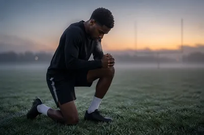 Athlete Kneeling in Prayer Before Dawn
