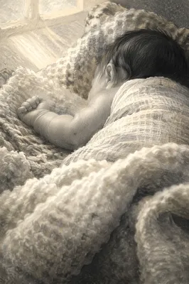 Peaceful Sleeping Newborn on Soft Blanket