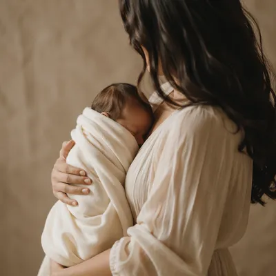 Peaceful Newborn Cradled in Ivory Blanket