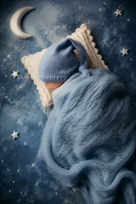 Peaceful Sleeping Newborn in Blue Blanket