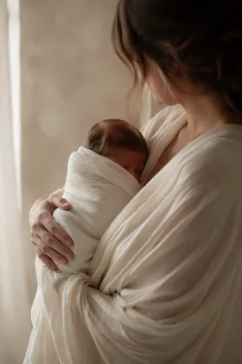 Peaceful Newborn Cradled in Ivory Blanket