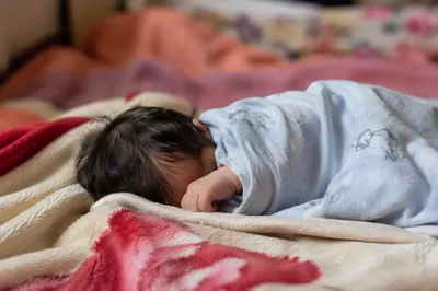 Peaceful Newborn Sleeping in Soft Blanket