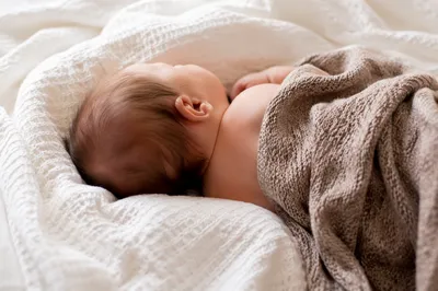 Peaceful Sleeping Newborn on Cozy Blanket