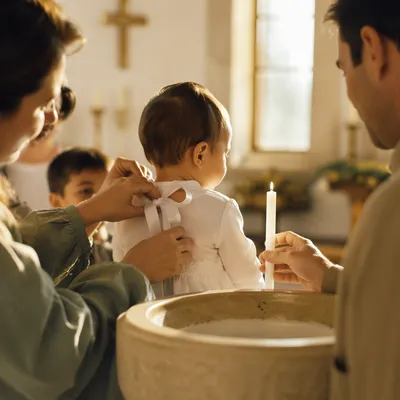 Smiling Baptized Child with Family Celebration