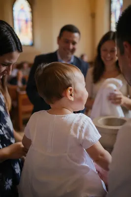 Smiling Baptized Child with Family Celebration