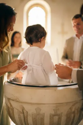 Smiling Baptized Child with Family Celebration