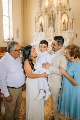Smiling Child With Family in Church