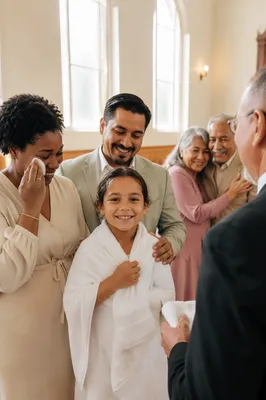 Smiling Baptized Child With Family in Church
