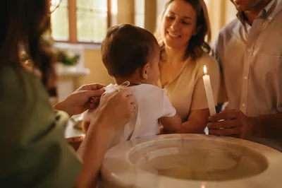 Smiling Baptized Child with Family Celebration