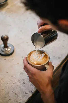 Barista Pouring Latte Art Overhead