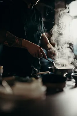 Moody Chef Preparing Food in Kitchen
