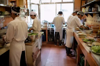 Busy Chefs Preparing Food in Restaurant Kitchen