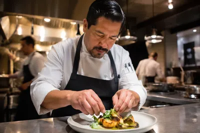 Chef Plating Dish in Restaurant Kitchen