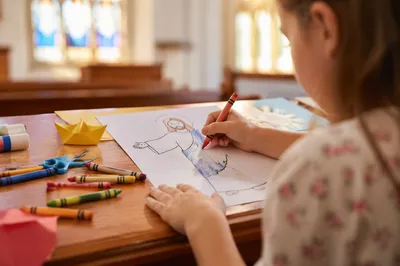 Child Coloring Church Craft at Table