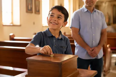 Happy Boy Donating Coin in Church