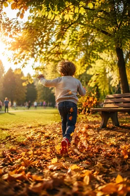 Happy Child Running Through Autumn Park