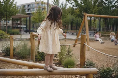 Happy Child Playing on Park Balance Beam
