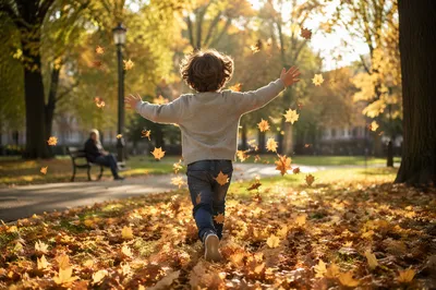 Happy Child Running Through Autumn Park