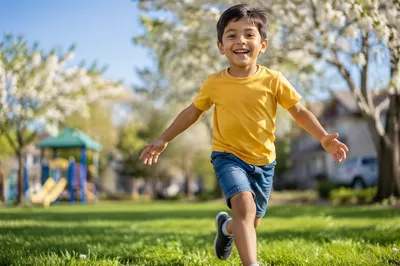 Smiling Boy Running Through Sunny Park