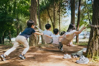 Happy Children Playing on Park Hammock