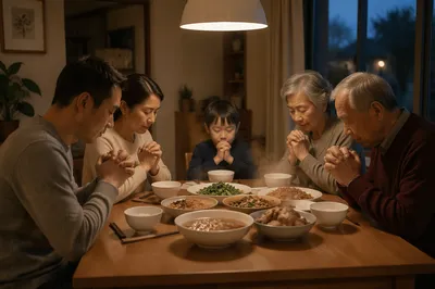 Chinese Family Praying at Dinner Table