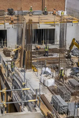 Urban Construction Workers on Busy Building Site