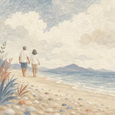 Mature Couple Walking Hand in Hand on Beach