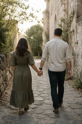 Couple Holding Hands Beside Chapel Garden