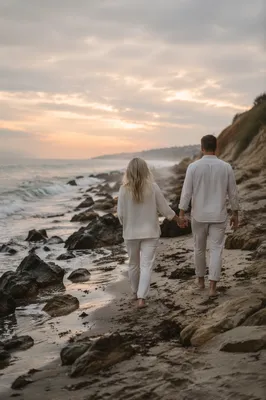Romantic Couple Walking Along Rocky Shoreline