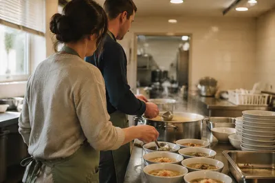 Couple Serving Meal in Church Kitchen