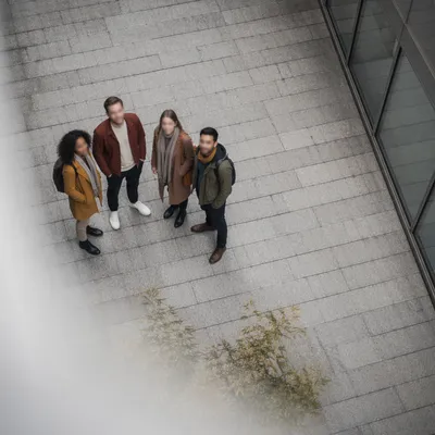 Multicultural Friends Together in Urban Courtyard