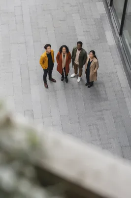 Multicultural Friends Looking Up in Courtyard