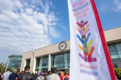 Multicultural Togetherness Outside Modern Civic Building