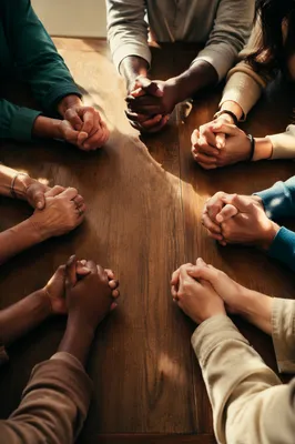 Diverse Prayer Circle Hands Around Table
