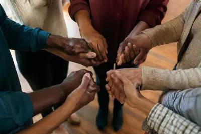 Diverse Prayer Circle with Joined Hands