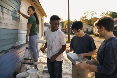 Teenagers Painting Community Building Exterior Together