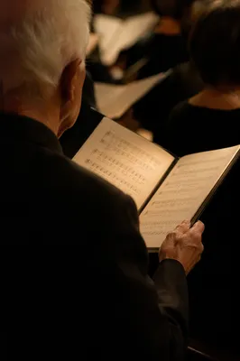 Elderly Choir Member Holding Hymnal Sunday