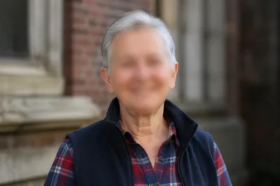 Gentle Elderly Portrait in Urban Daylight