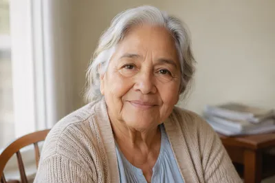Elderly Hispanic Woman Smiling by Window